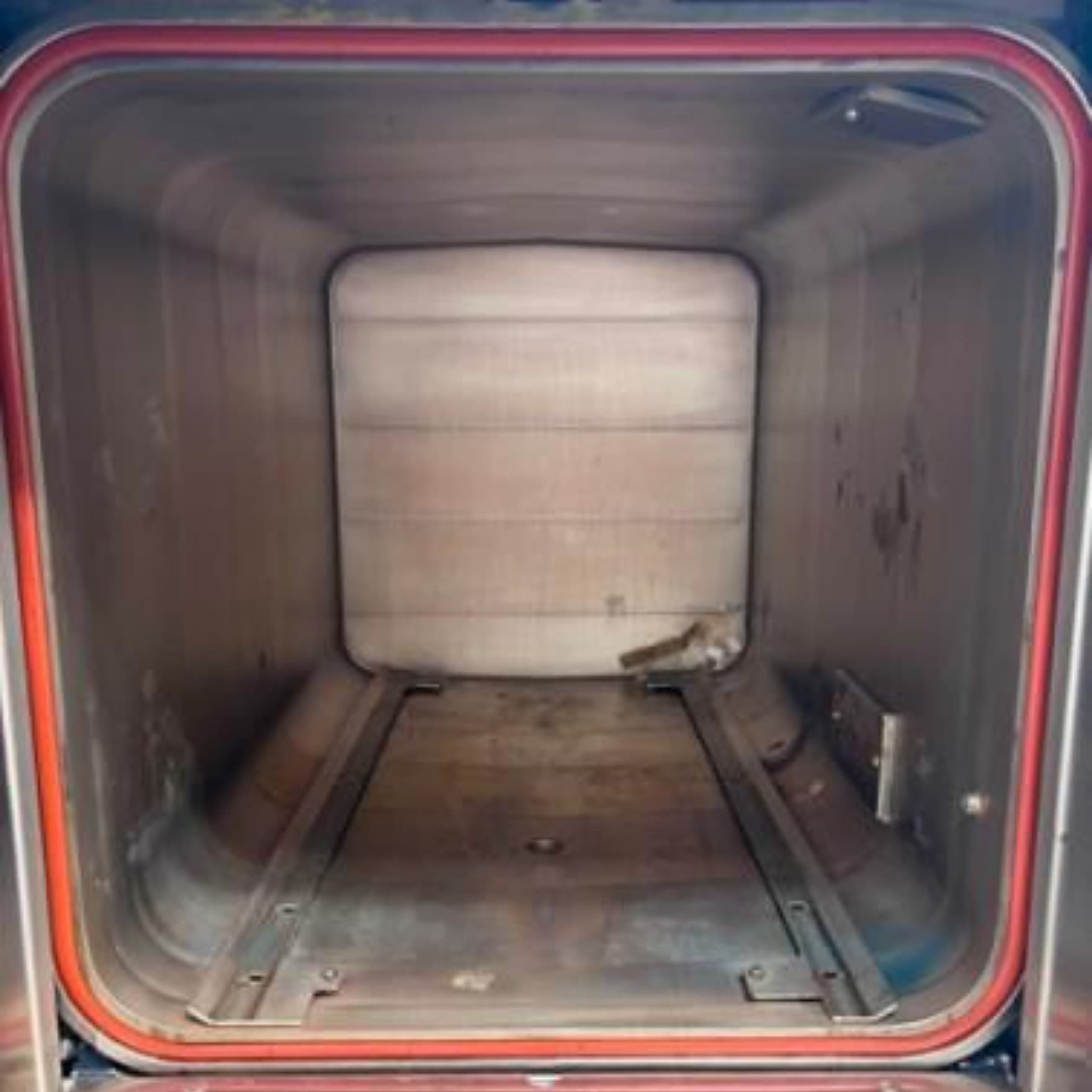 Sterilizer chamber before a Maximo Medical cleaning, with staining and buildup on the stainless surfaces