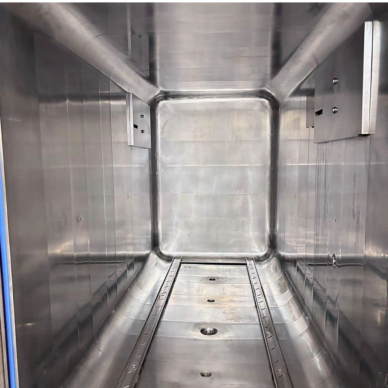 The same larger sterilizer chamber after cleaning, the staining lifted