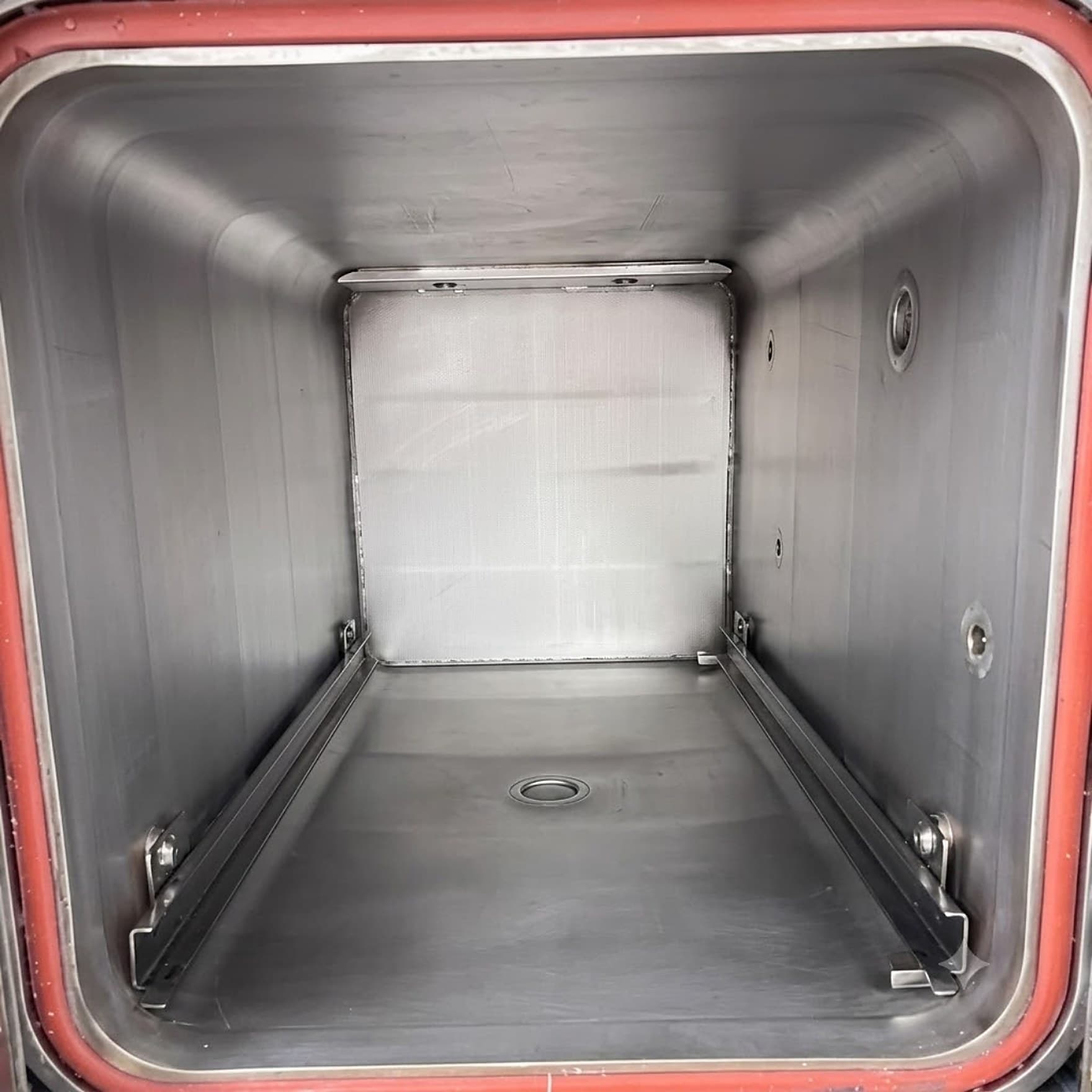 The same sterilizer chamber after cleaning, the staining lifted from the walls and floor