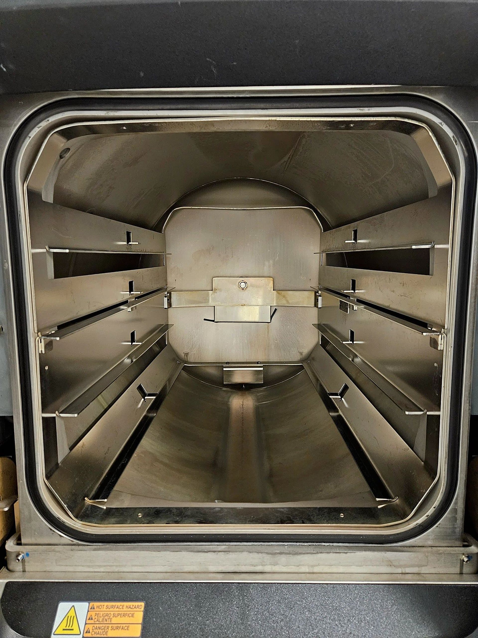 Sterilizer chamber interior with staining and mineral buildup before cleaning by Maximo Medical
